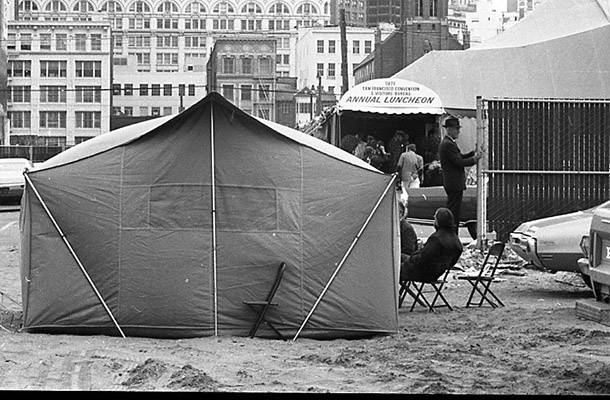 Tenants and Owners in Opposition to Redevelopment tent stands across the street from the San Francisco Convention & Visitors Bureau Annual Luncheon June 1971 TOR-0214.jpg