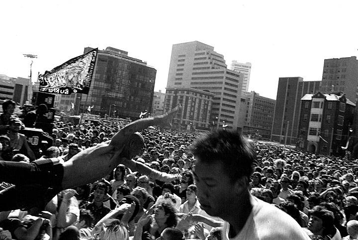 File:July-1984-stage-diver-at-rock-against-racism-concert-in-front-of-Democratic-Convention.jpg
