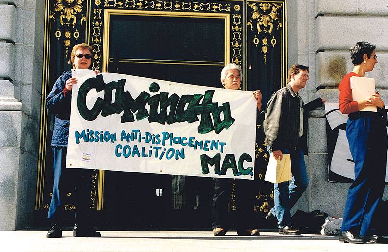 Bill-Sorro-and-Betty-Traynor-on-City-Hall-steps-during-1999-Grant-Bldg-protest-with-MAC-sign.jpg