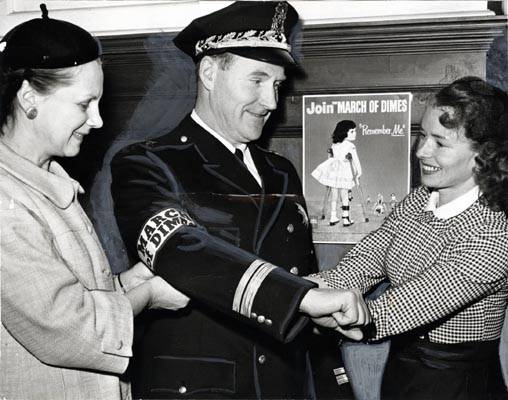 File:Mrs. Haurat, area chairman, and Mrs. Valdespino, chairman of the Mother's March on Polio with Deputy Police Chief Thomas Cahill jan 28 1957 AAK-1326.jpg