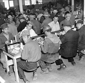 Workers dining in a cafeteria at Hunters Point Drydock; notably not an integrated cafeteria at in this 1943 photo, courtesy San Francisco History Center, San Francisco Public Library