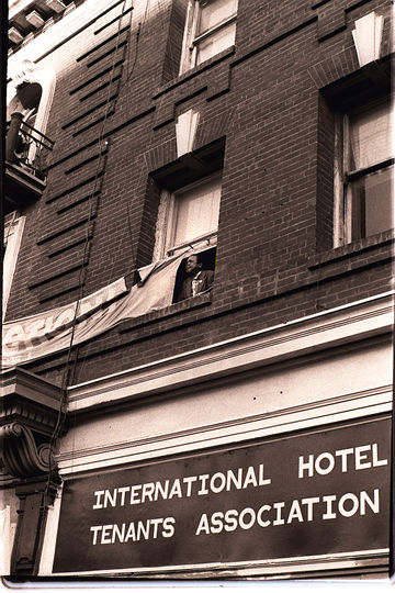 Joe Diones looks out the window of the I-Hotel on 848 Kearny Street Nancy Wong.jpg