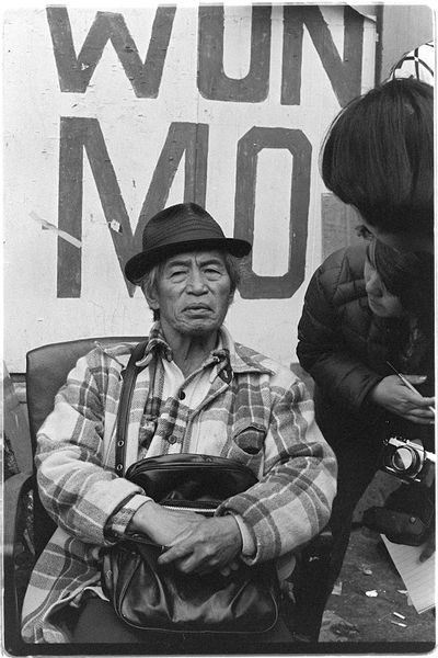 Wahat Tompao sits on the street outside the hotel at 848 Kearny, San Francisco Nancy Wong.jpg