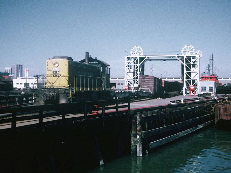 File:Switching-at-China-Basin-slip-in-San-Francisco,-CA.-Santa-Fe-tugs-John-R.-Hayden-(left)-and-Paul-P.-Hastings-stand-by-near-barges-6-and-8.-Western-Railway-Museum-Archives.-Jeff-Moreau-collection.-Circa-March-1971 88505atsf.jpg