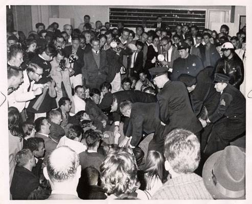 Police picking out demonstrators from the lobby of the Sheraton Palace Hotel March 7 1964 AAK-0899.jpg